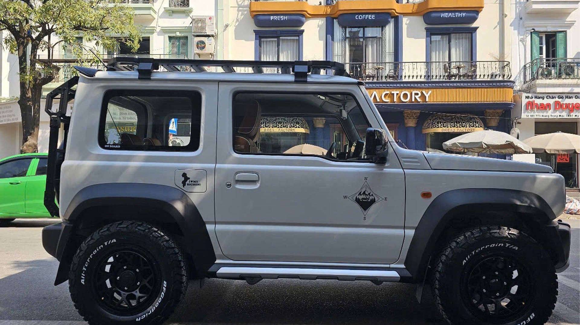 white Suzuki Jimny (2018+) fitted with Satin Black Magpie M-01 Wheels