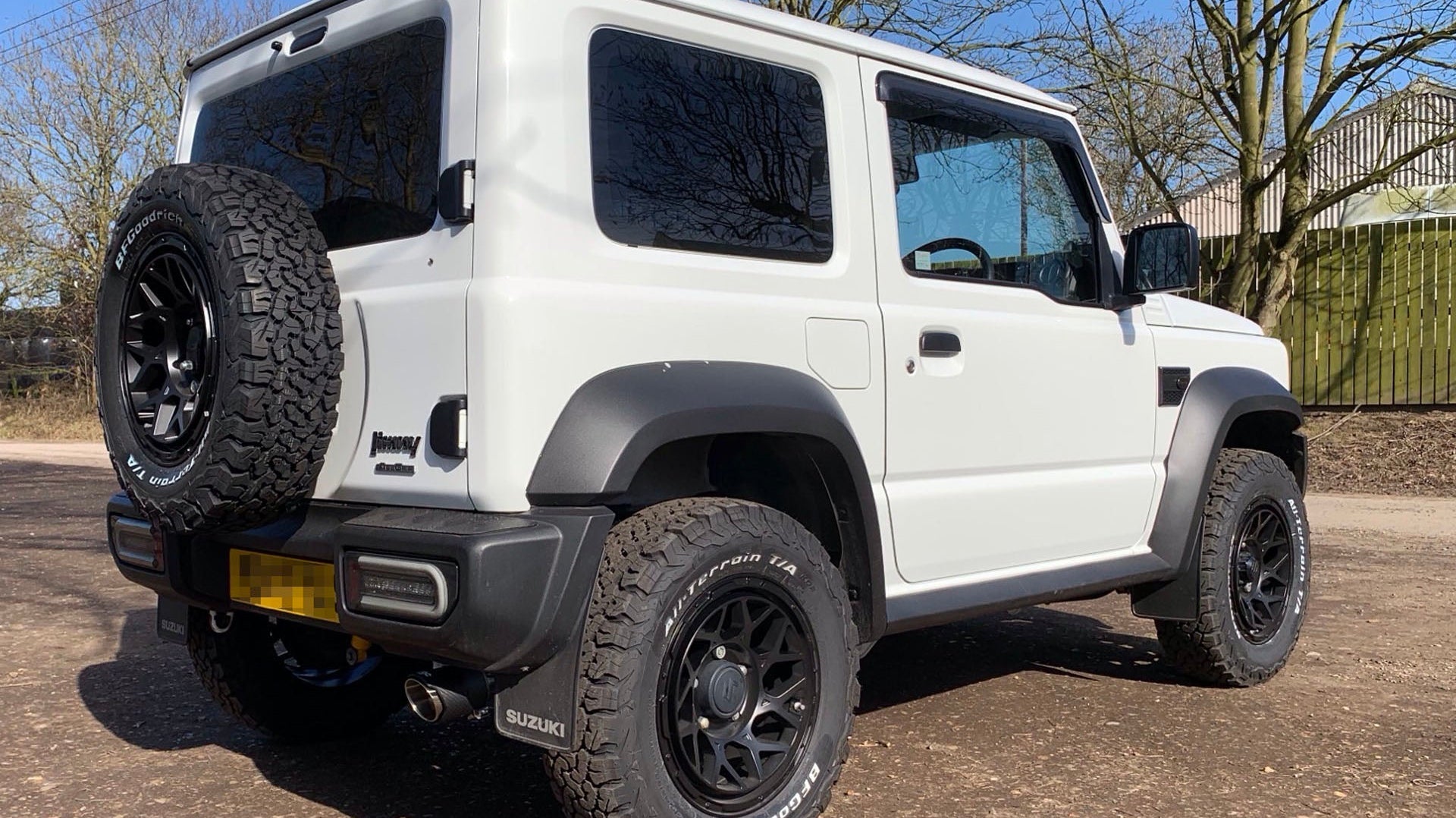 White Suzuki Jimny (2018+) fitted with Satin Black Magpie M-01 wheels