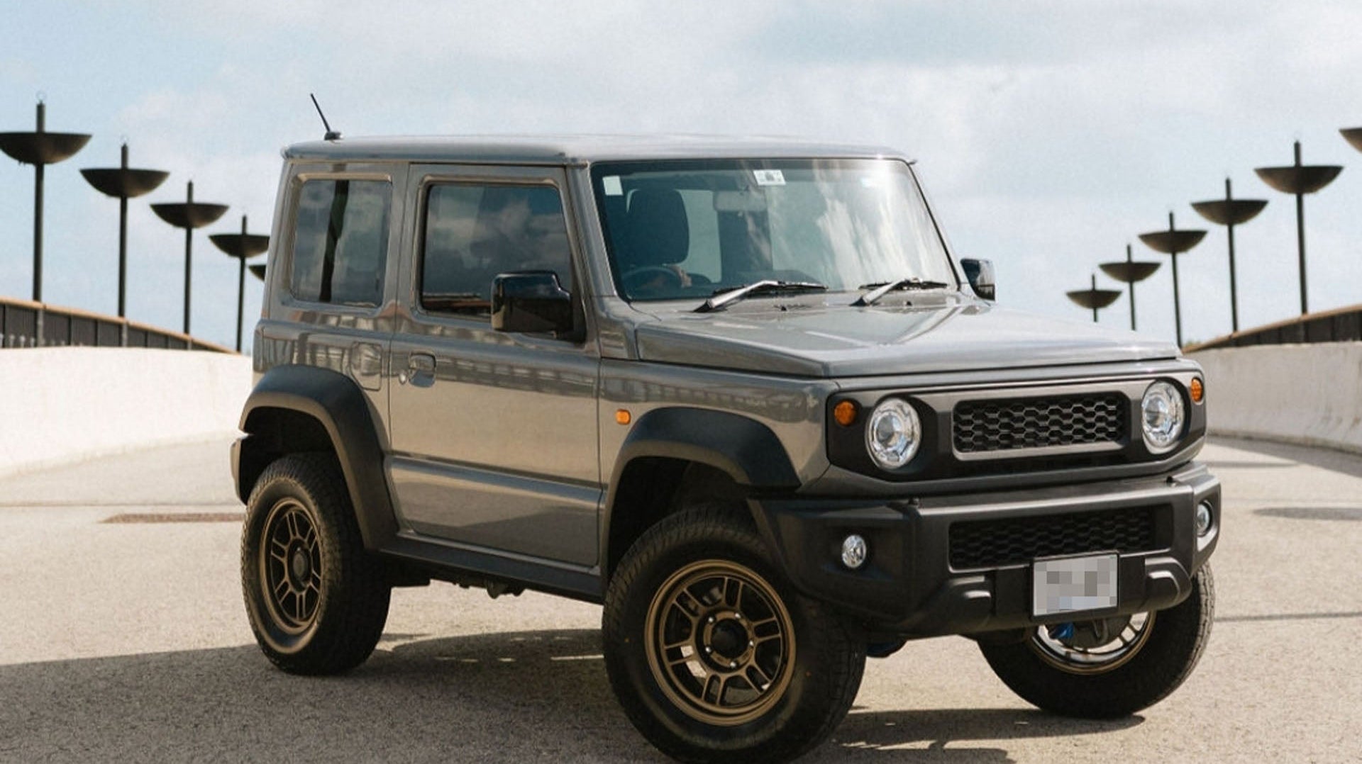 Grey Suzuki Jimny with Matte Bronze ENKEI ALLROAD RPT1 Wheels