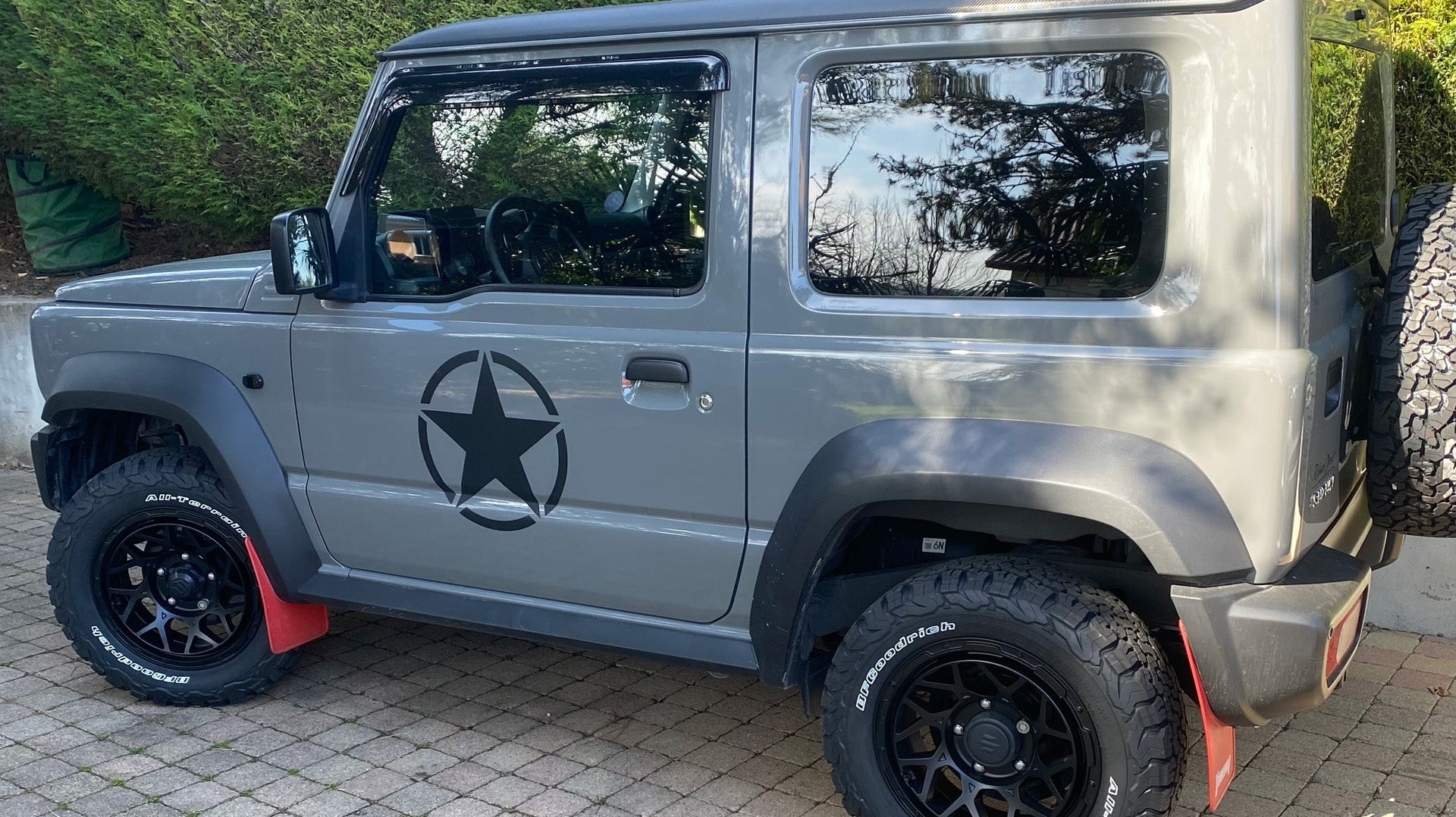Grey Suzuki Jimny (2018+) fitted with Satin Black Magpie M-01 wheels