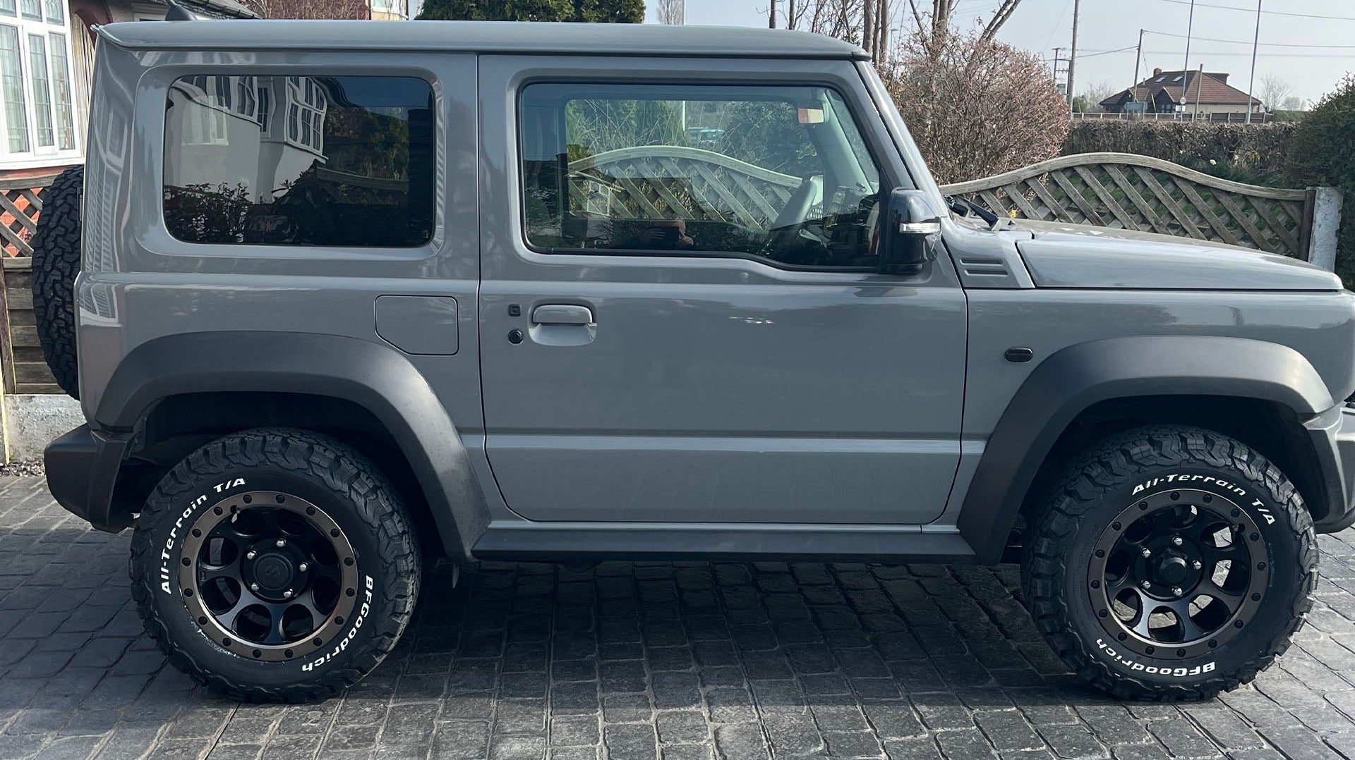 Grey Suzuki Jimny (2018+) fitted with XTREME-J XJ03 wheels and various smoked LED accessories