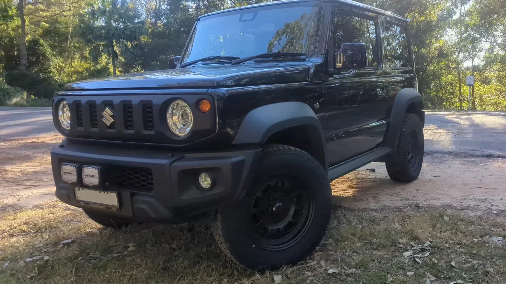 Suzuki Jimny (2018+) fitted with Matte Black High Peak J-01 wheels and Toyo Tyres in a 215/70R16