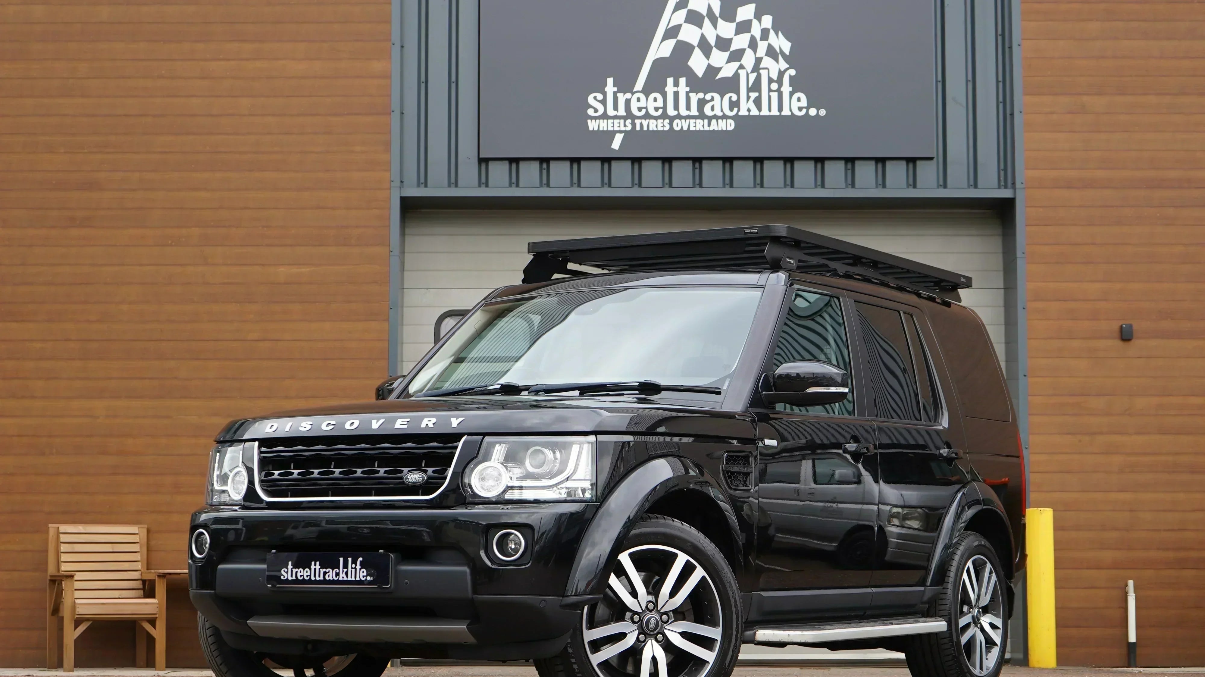 Black 2016 Land Rover Discovery 4 with Front Runner Slimline II Roof Rack and Rear Ladder. All installed at our Holmes Chapel workshop