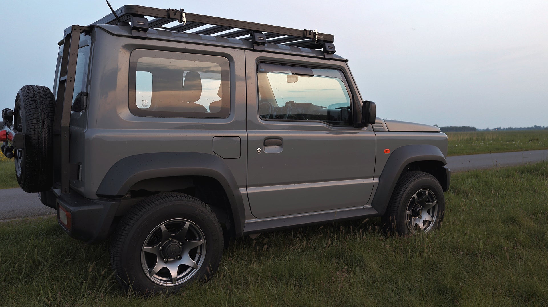 Suzuki Jimny (2018+) with HIGH PEAK J-02 15" wheels, Front Runner Slimline II Roof Rack and Ladder