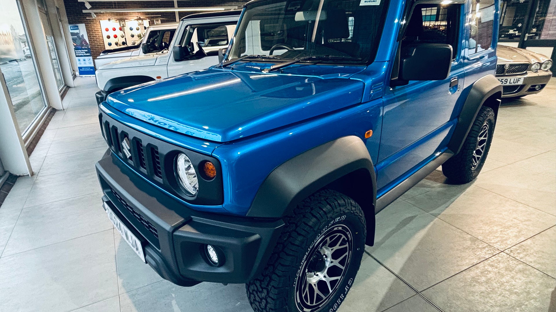 Blue Suzuki Jimny fitted with Satin Black with Machined Face Magpie M-01 wheels