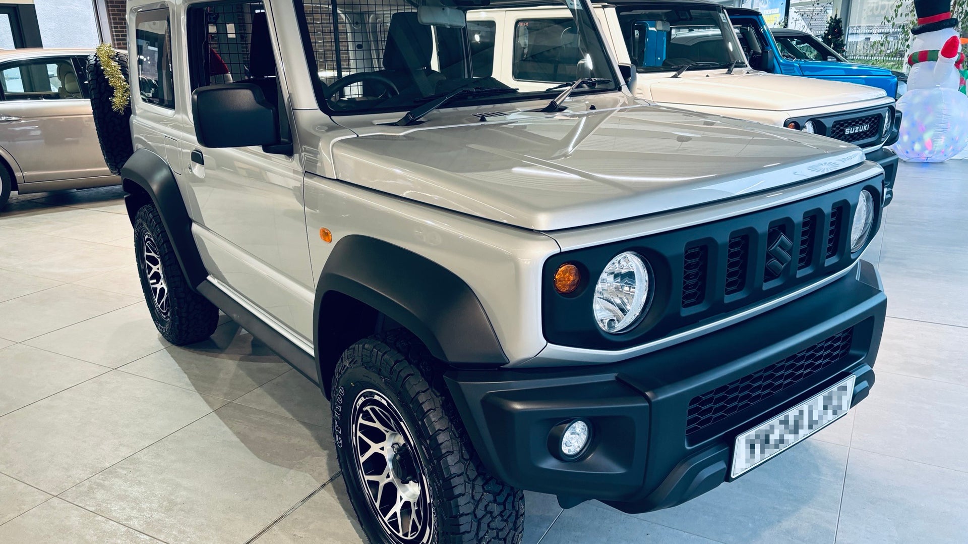 Silver Suzuki Jimny fitted with Magpie wheels in Satin Black with Machined Face
