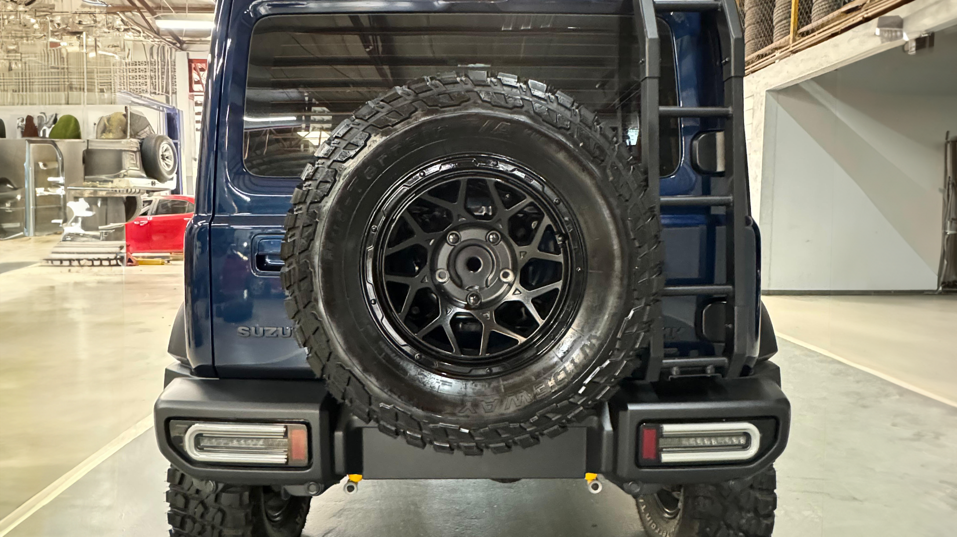 Suzuki Jimny (2023+) 5-Door with 16" Magpie M-01 Wheels with lifted suspension, JimnyStyle LED Tail Lights and other accessories.