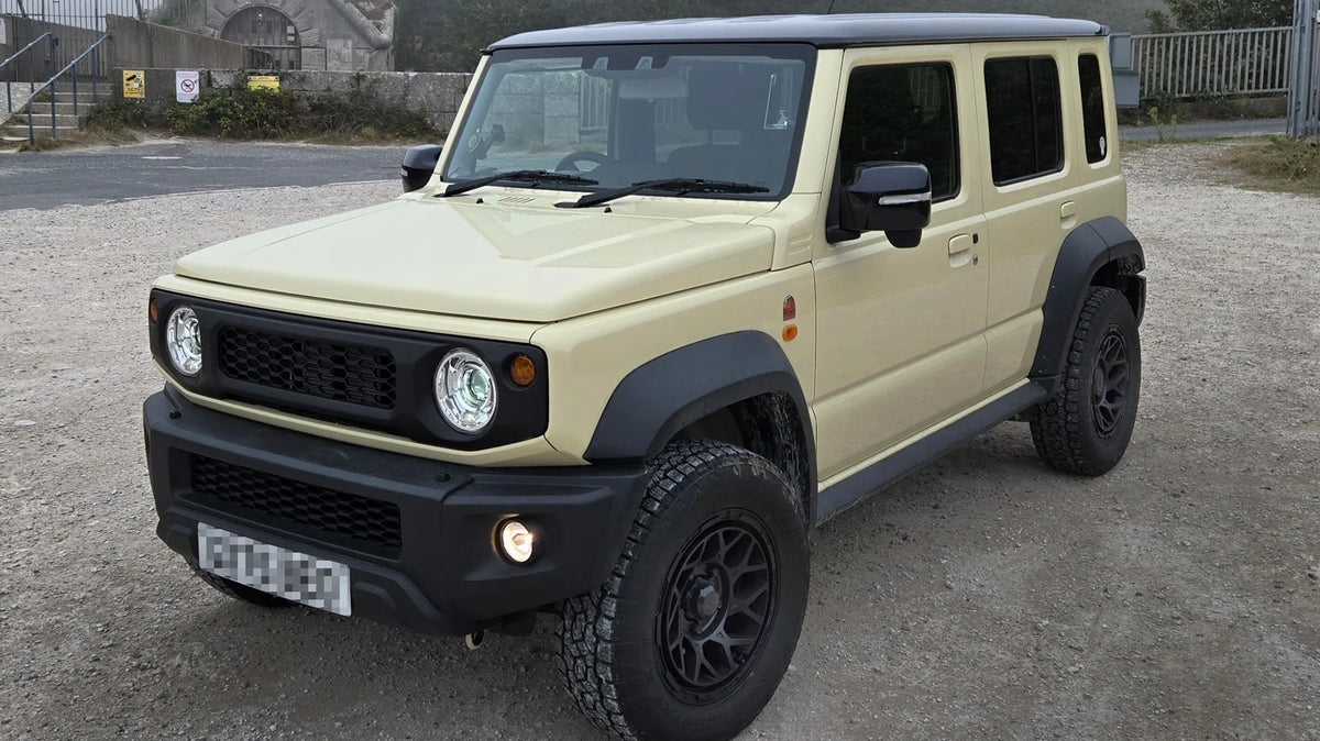 Chiffon Ivory Suzuki Jimny Nomade (5-door) with Magpie M-01 wheels and Retro Grille