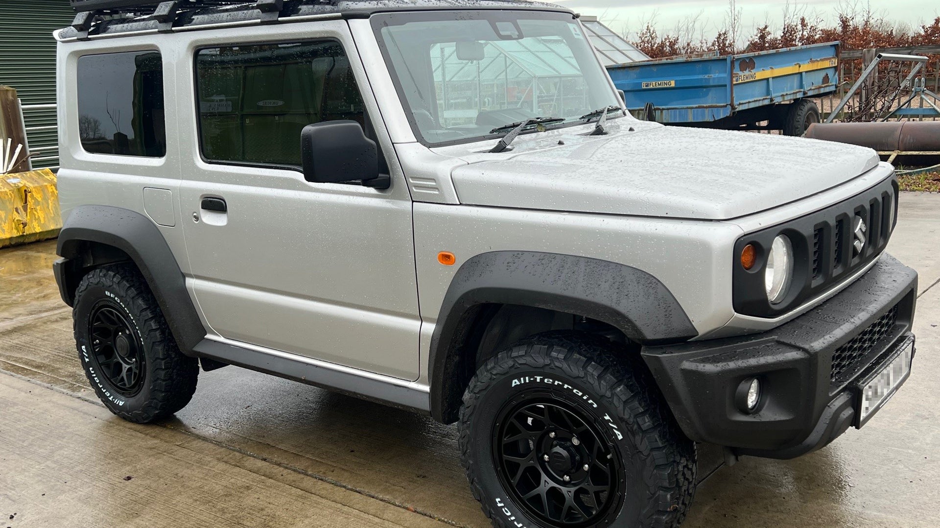 Silver Suzuki Jimny fitted with Satin Black Magpie M-01 Wheels