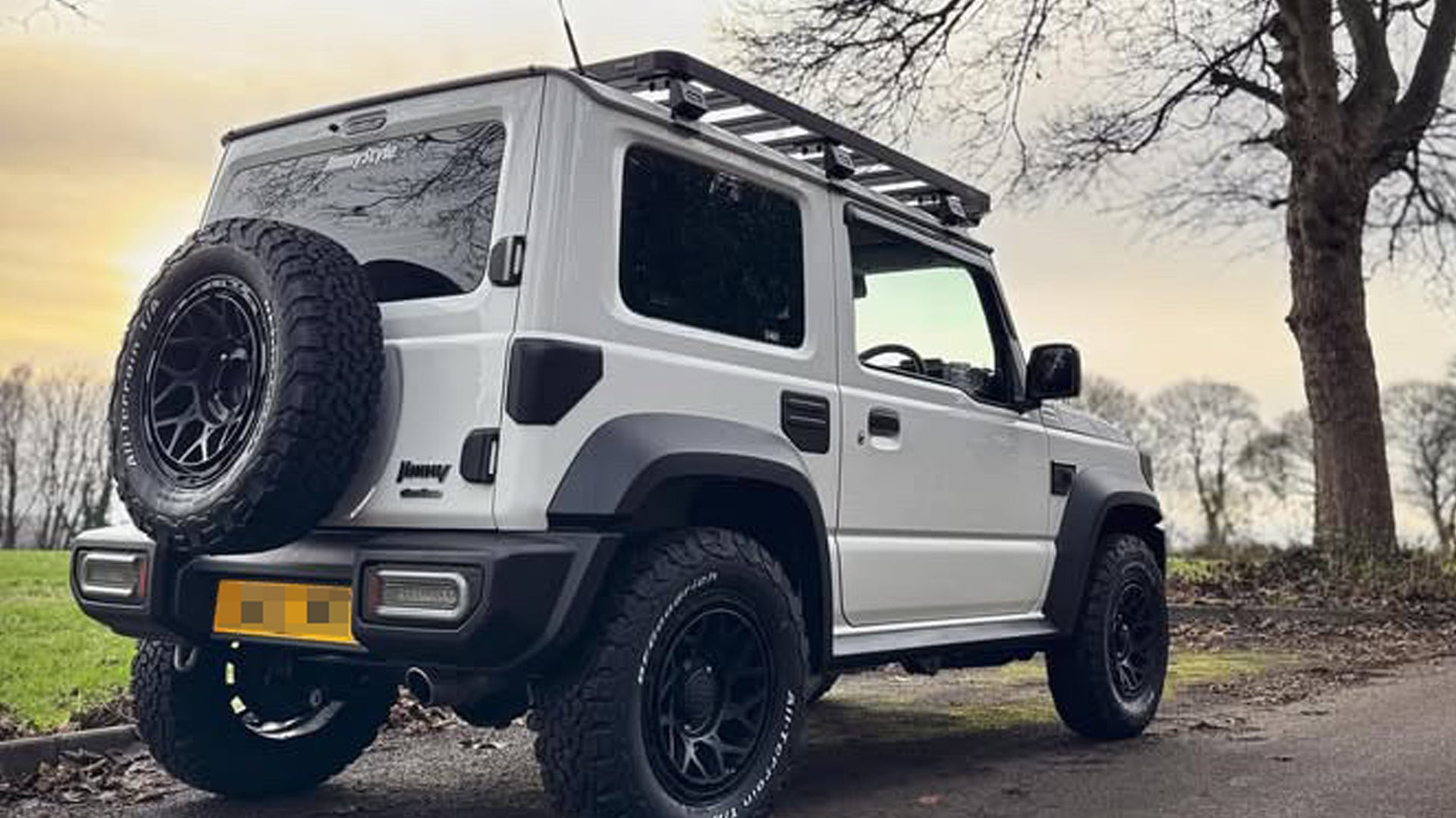 White Suzuki Jimny with Satin Black Magpie M-01 wheels and various accessories