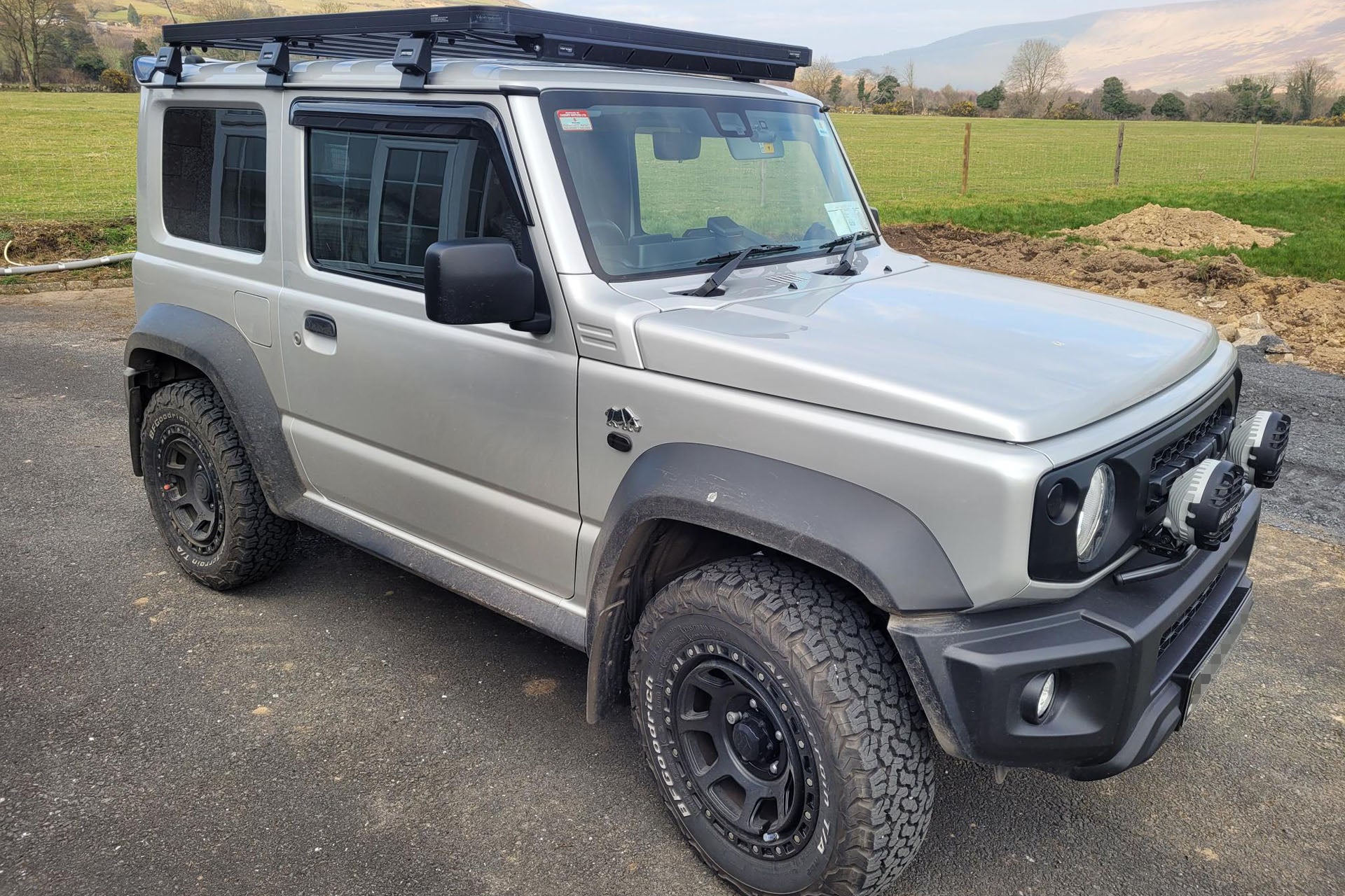 Silver Suzuki Jimny (2018+) fitted with Satin Black XTREME-J XJ07 wheels