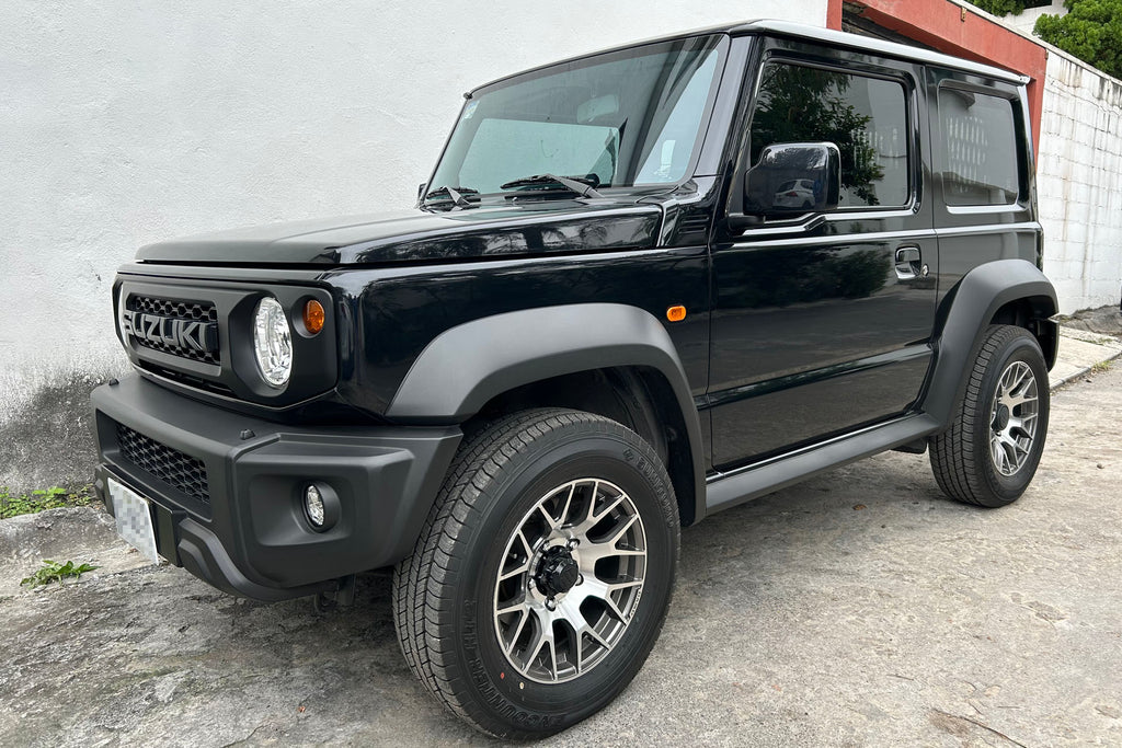 Black Suzuki Jimny (2018+) fitted with Dark Graphite DAMD Little G Wheels