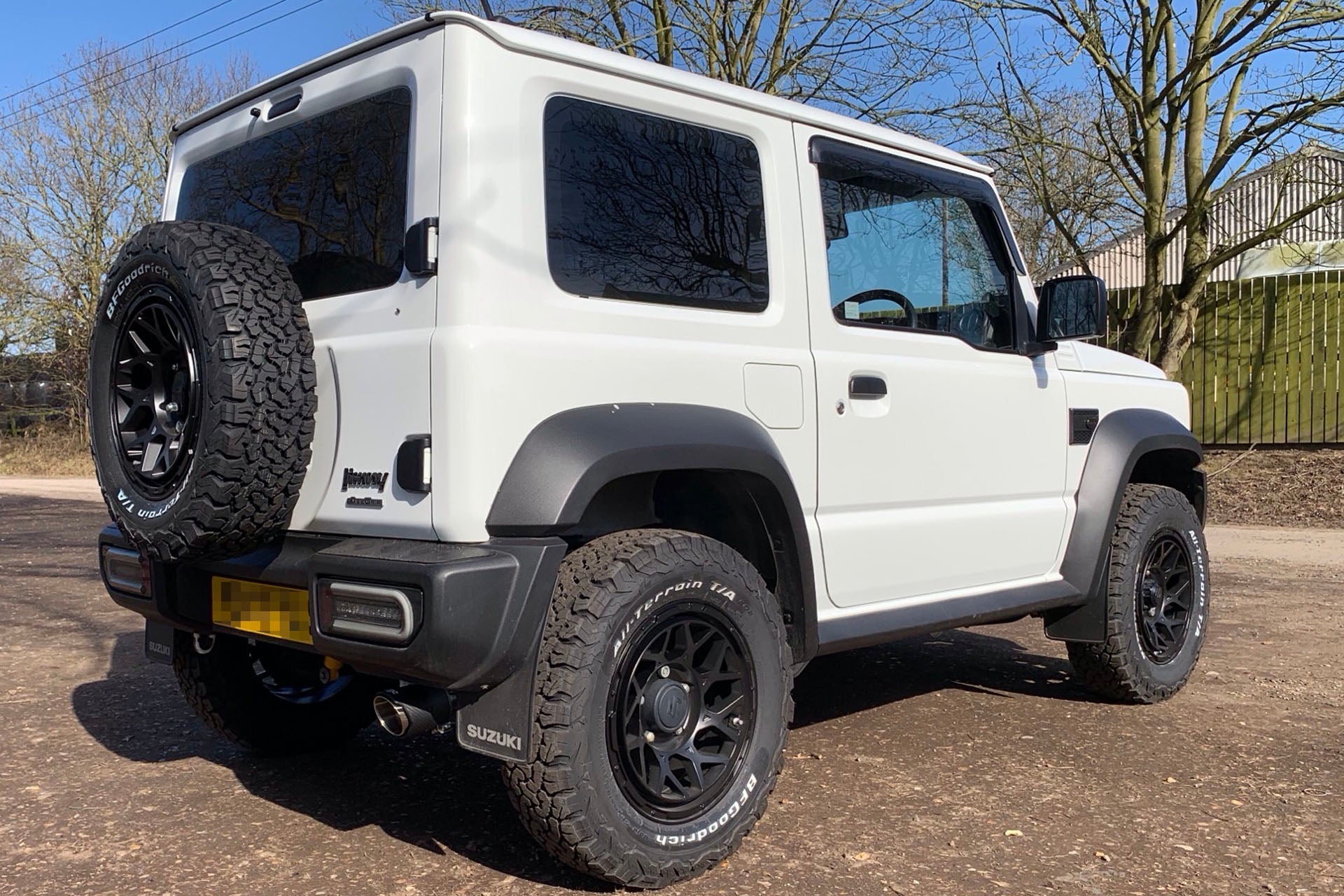 White Suzuki Jimny (2018+) fitted with Satin Black Magpie M-01 wheels