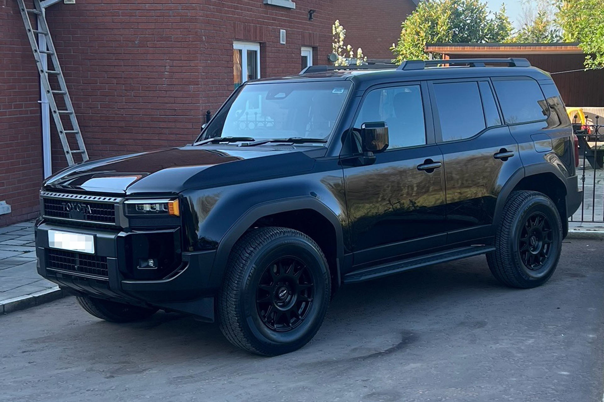 Black Toyota Land Cruiser 250 (2024+) fitted with 18' EVO Corse DakarZero wheels in Matte Black