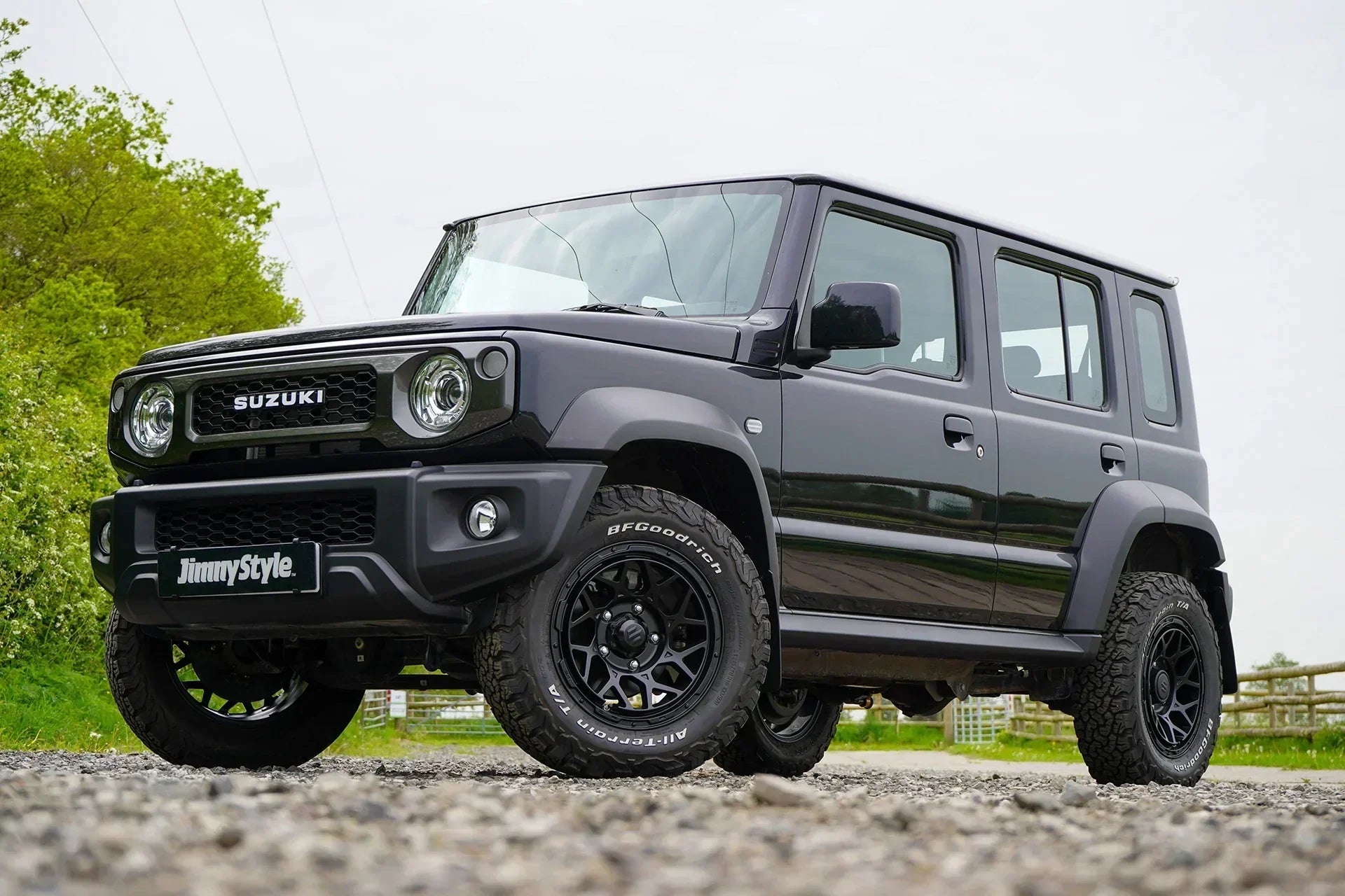 a modified 5-door Jimny with a Jimnystyle  Touring suspension kit, Pipercross air intake, Magpie M-01 wheels and various LED and interior accessories.