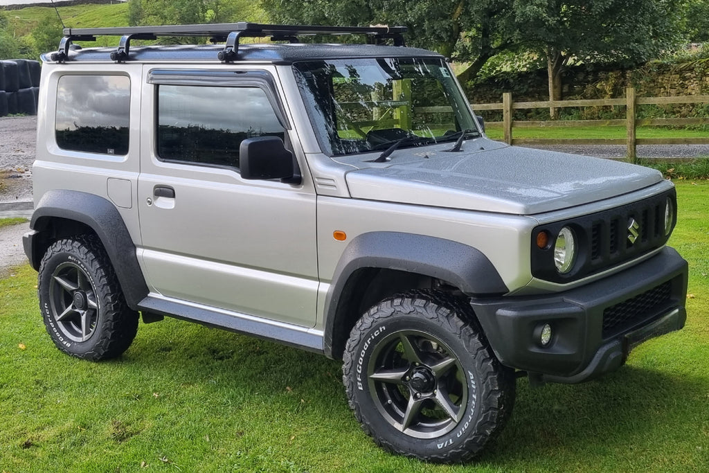 Suzuki Jimny (2018+) with 16" APIO WILDBOAR X2 Wheels on standard suspension, IPF Roof Rack and IPF Rear Ladder.